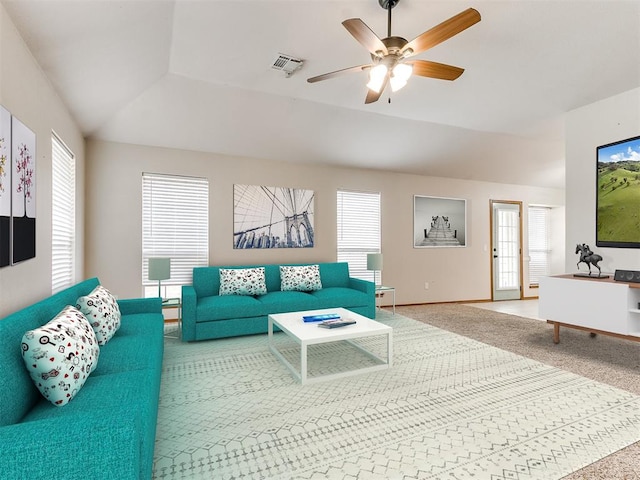 living room with carpet floors, ceiling fan, and lofted ceiling