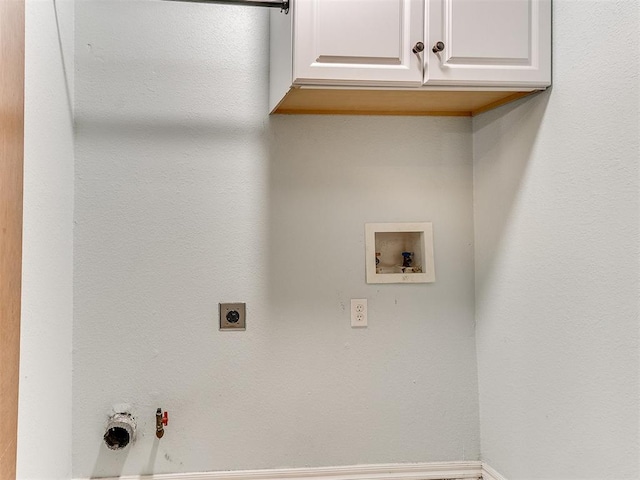 laundry area with electric dryer hookup, gas dryer hookup, cabinets, and washer hookup