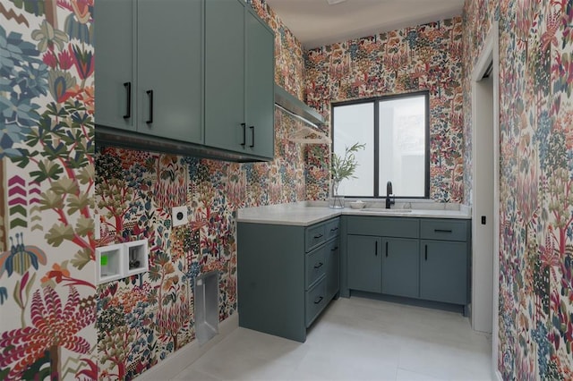 laundry room with cabinets, sink, and electric dryer hookup