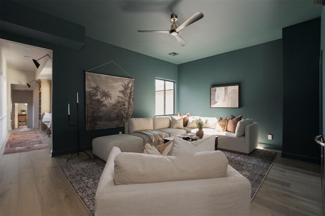 living room with hardwood / wood-style flooring and ceiling fan