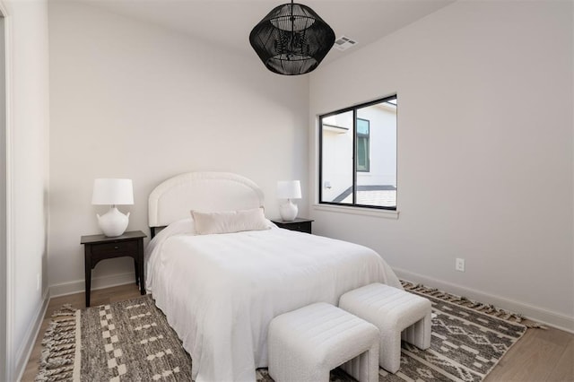 bedroom featuring hardwood / wood-style flooring