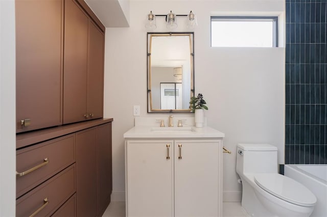 full bathroom with toilet, vanity, and tiled shower / bath