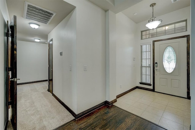 foyer with light hardwood / wood-style flooring