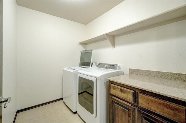 laundry room with cabinets and independent washer and dryer