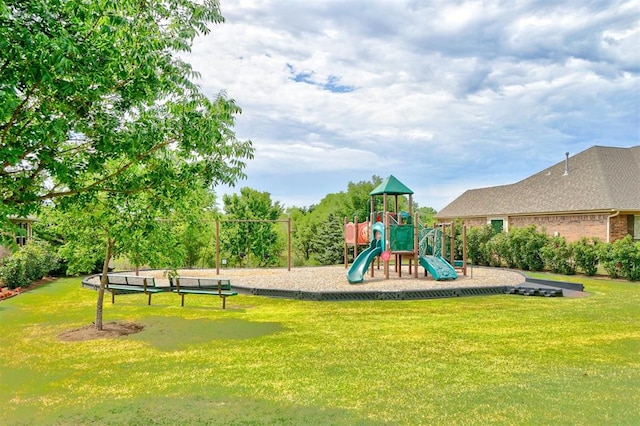 view of playground featuring a lawn