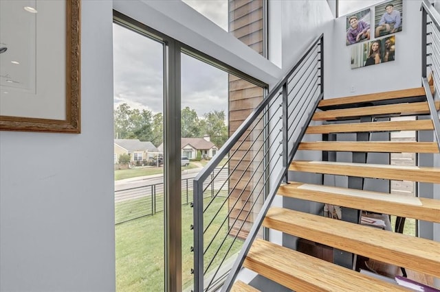 stairway featuring plenty of natural light