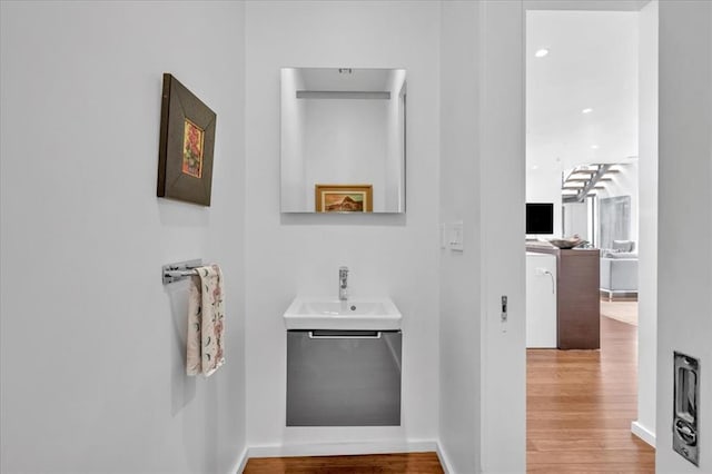 bathroom featuring sink and hardwood / wood-style flooring