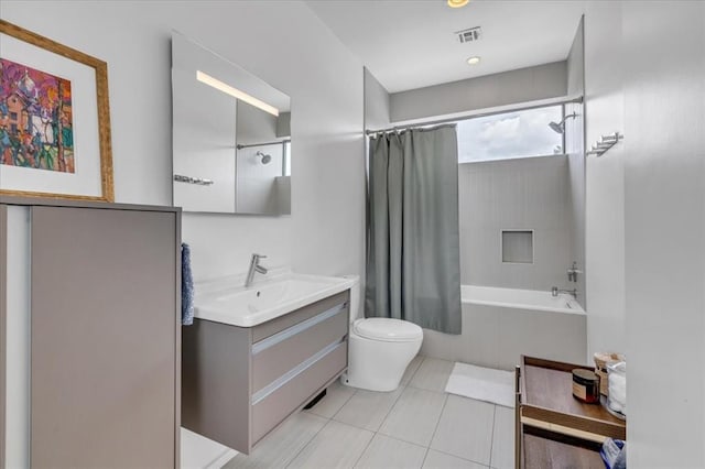 full bathroom with tile patterned floors, vanity, toilet, and shower / tub combo with curtain