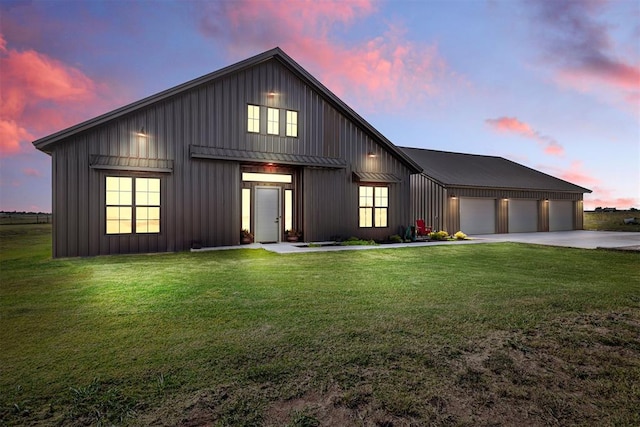 modern inspired farmhouse featuring a lawn