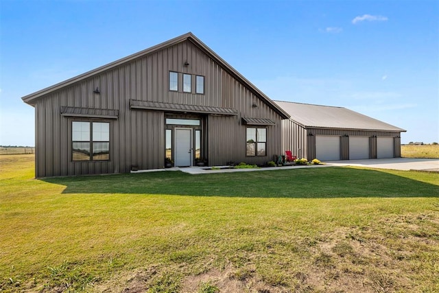 modern farmhouse style home featuring a garage and a front lawn