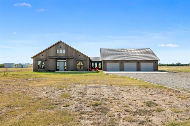 view of front of property with an outdoor structure and a garage