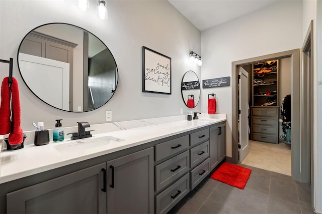 bathroom with tile patterned flooring and vanity