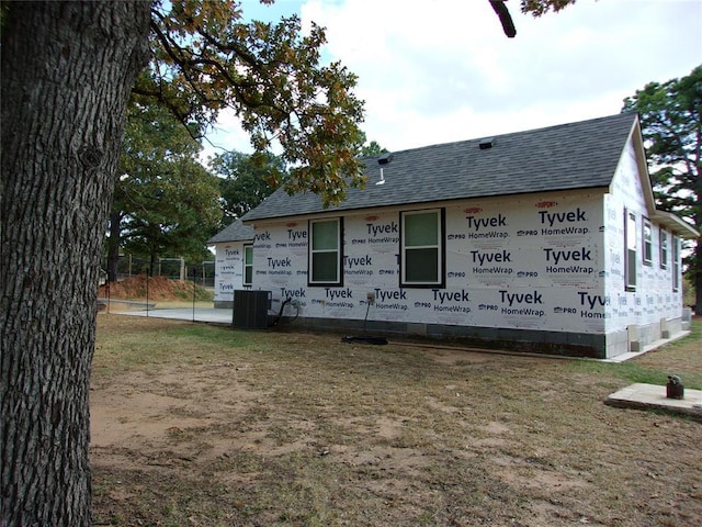 33322 Hardesty Rd, Shawnee, OK 74801 - back of house featuring a shingled roof
