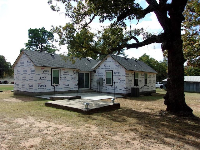 33322 Hardesty Rd, Shawnee, OK 74801 - back of property with a patio, a yard, and a shingled roof
