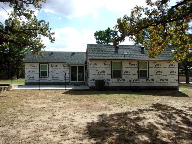 back of house with a patio area and central AC unit