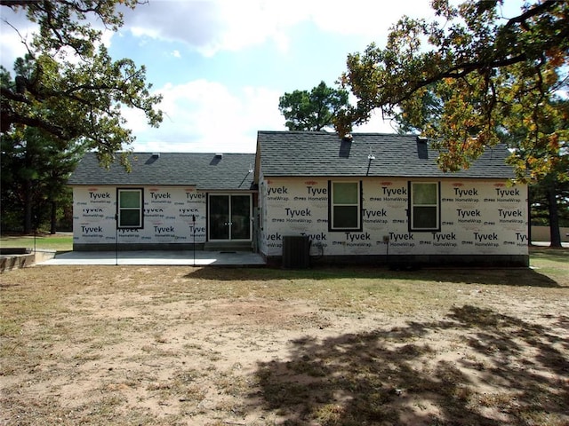 33322 Hardesty Rd, Shawnee, OK 74801 - back of property featuring roof with shingles and a yard