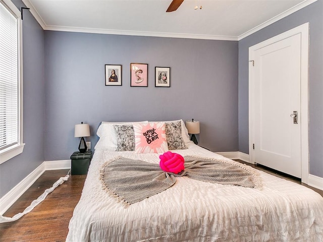 bedroom featuring multiple windows, ceiling fan, crown molding, and dark wood-type flooring