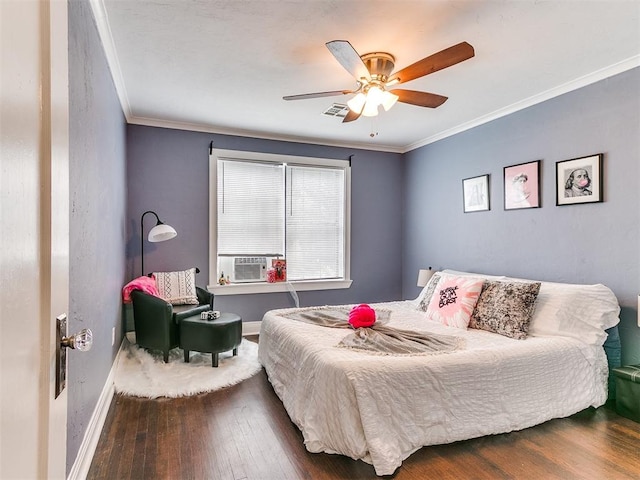 bedroom with hardwood / wood-style flooring, ceiling fan, and crown molding