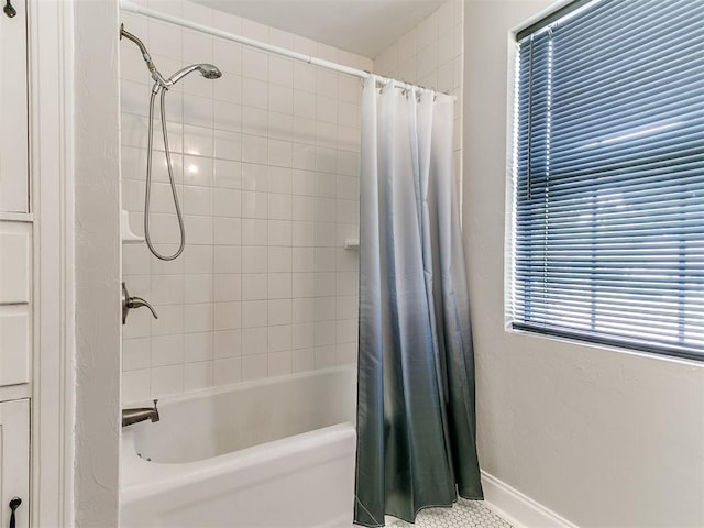 bathroom with shower / bath combination with curtain