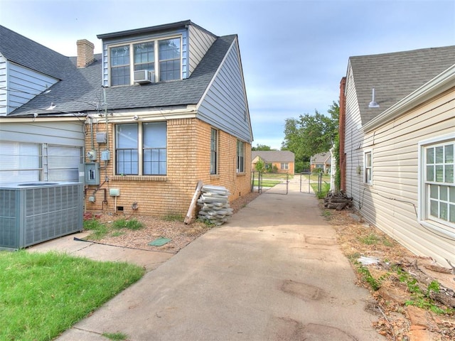 view of side of property with central AC