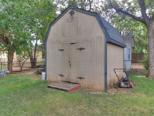 view of outdoor structure with a lawn