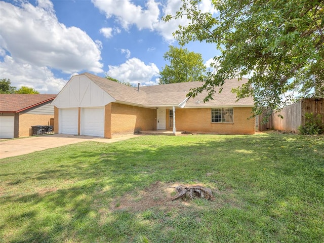 ranch-style home featuring a garage and a front lawn