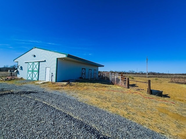 view of outdoor structure featuring a rural view