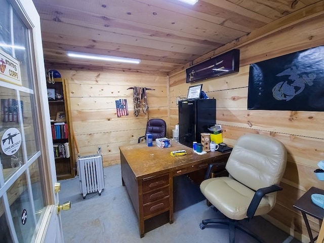 home office with wooden walls, wooden ceiling, and radiator