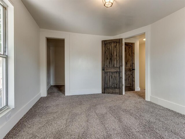 unfurnished bedroom featuring carpet floors