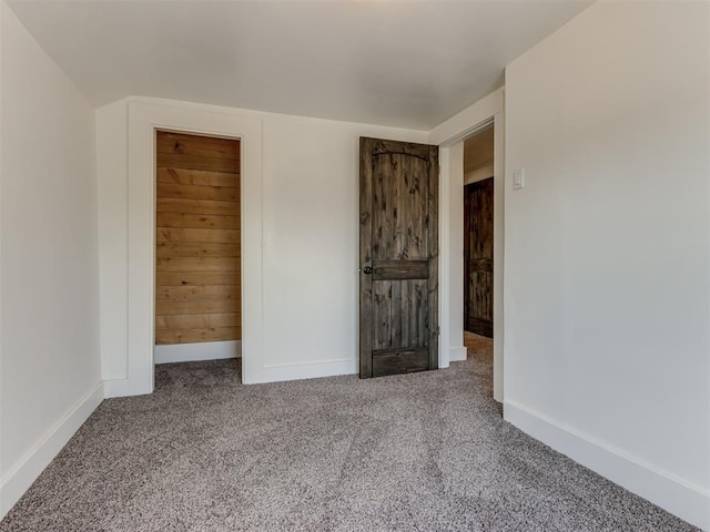 unfurnished bedroom with carpet floors