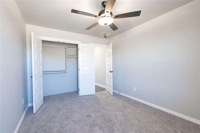 unfurnished bedroom featuring ceiling fan, carpet floors, a closet, and baseboards