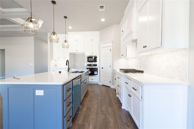 kitchen featuring white cabinetry, visible vents, appliances with stainless steel finishes, and decorative backsplash