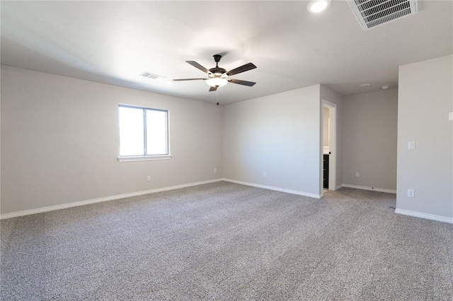 unfurnished room with baseboards, visible vents, ceiling fan, and light colored carpet