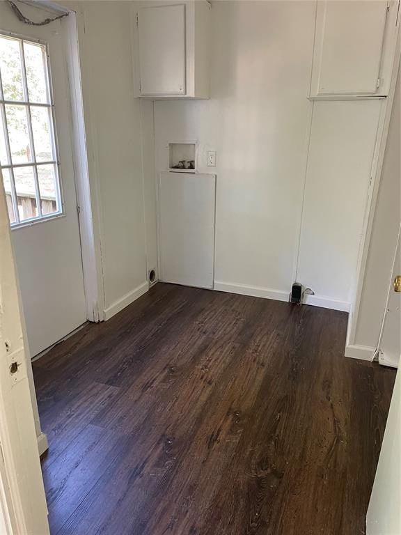 laundry room featuring hookup for a washing machine, dark hardwood / wood-style flooring, and cabinets