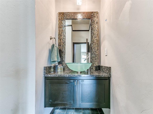 bathroom with tile patterned flooring and vanity