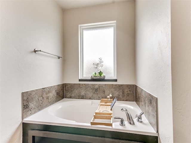 bathroom with a tub