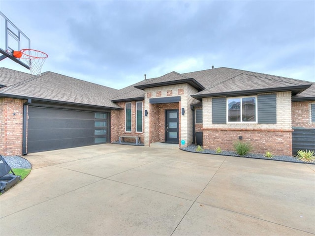 prairie-style home featuring a garage