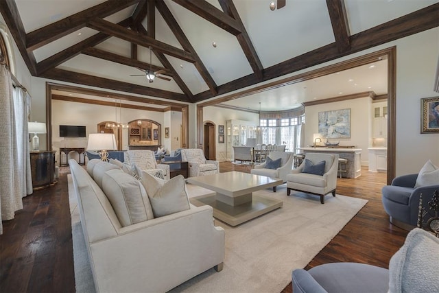 living room with ornamental molding, ceiling fan with notable chandelier, beam ceiling, high vaulted ceiling, and hardwood / wood-style floors