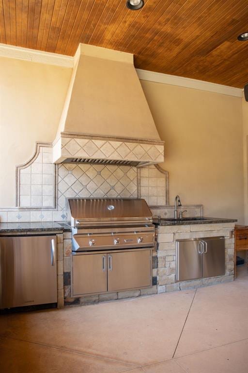 view of patio with a grill, exterior kitchen, and sink