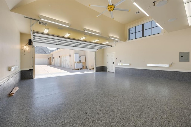 garage featuring electric panel and ceiling fan