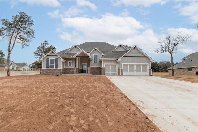 craftsman house featuring driveway, a garage, board and batten siding, and roof with shingles