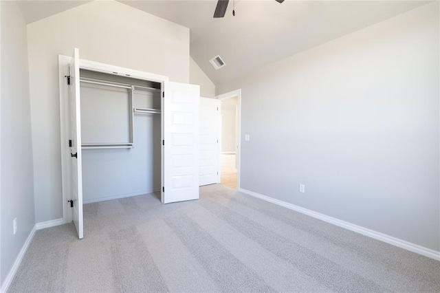 unfurnished bedroom featuring visible vents, baseboards, carpet flooring, and vaulted ceiling