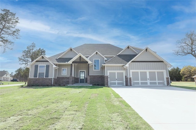 craftsman inspired home featuring an attached garage, board and batten siding, concrete driveway, a front lawn, and roof with shingles