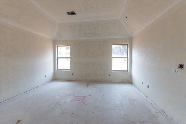 unfurnished room with vaulted ceiling and plenty of natural light