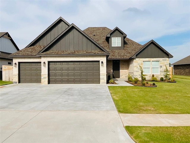 craftsman-style home featuring a front yard and a garage