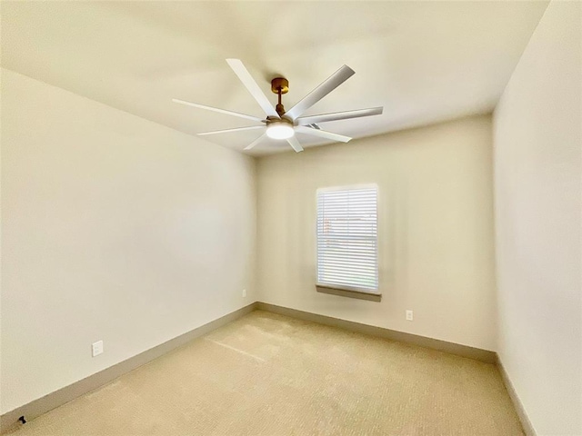 unfurnished room with carpet flooring and ceiling fan