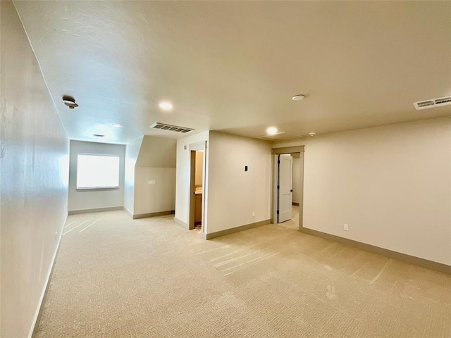 bonus room with light carpet