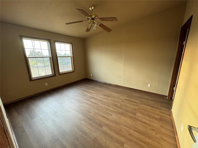 spare room featuring ceiling fan and light wood-type flooring