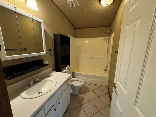 full bathroom with vanity, bathing tub / shower combination, tile patterned floors, toilet, and a textured ceiling