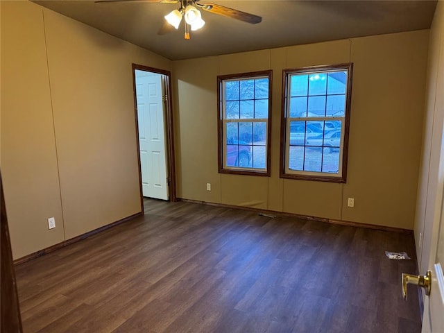 interior space with ceiling fan and dark hardwood / wood-style floors